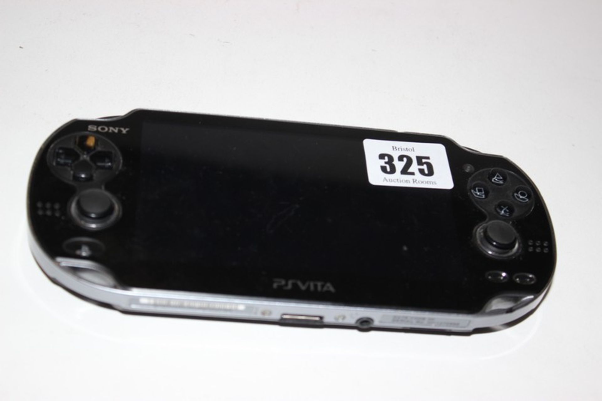 A Sony PSVita model: PCH-1004 and one game.