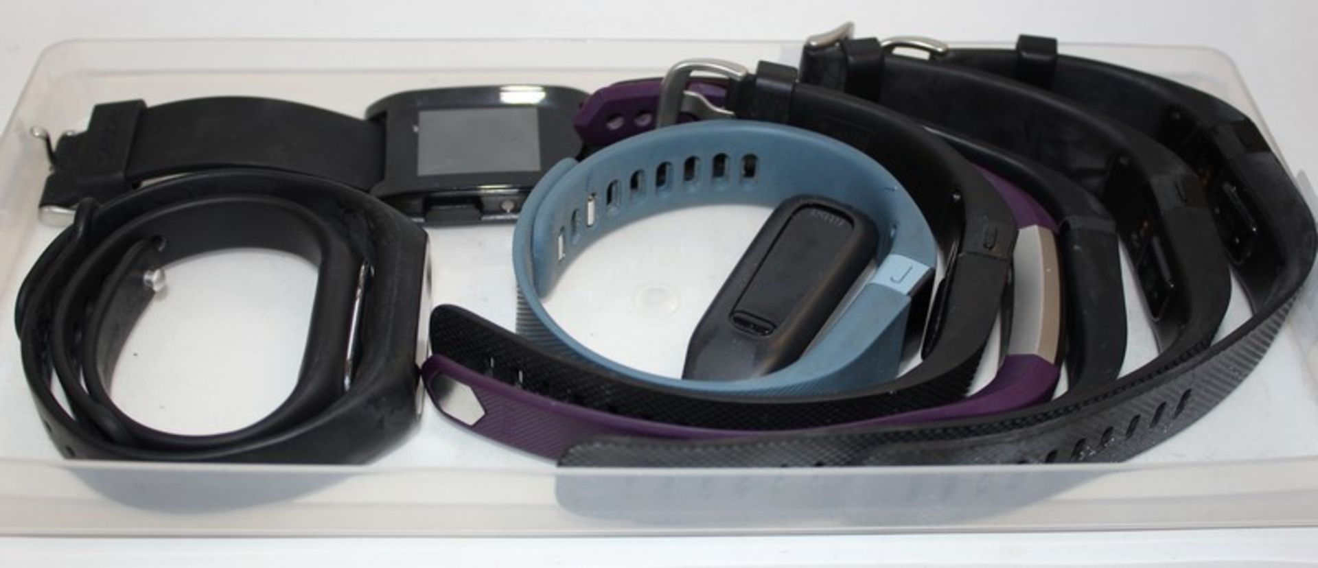 Seven Fitbit activity trackers and three other activity trackers.