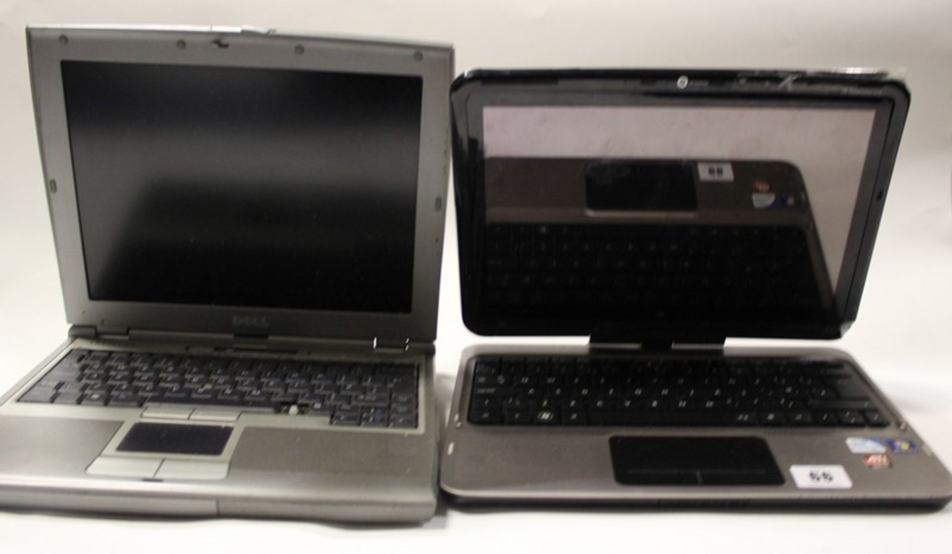 A Dell Latitude D400 model: PPT (Hard drive removed) and a HP TouchSmart tm2 laptop (Hard drive