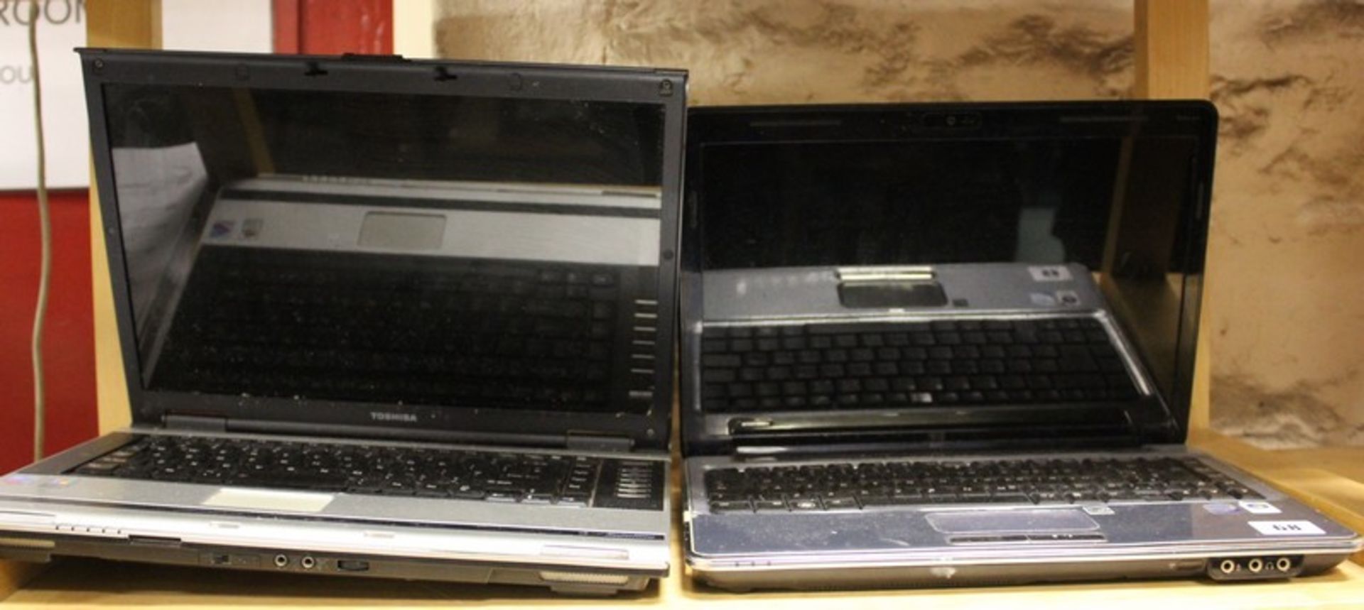 A Toshiba Satellite M70-267 laptop (Hard drive removed) and an HP Pavilion dv4 laptop (Hard drive