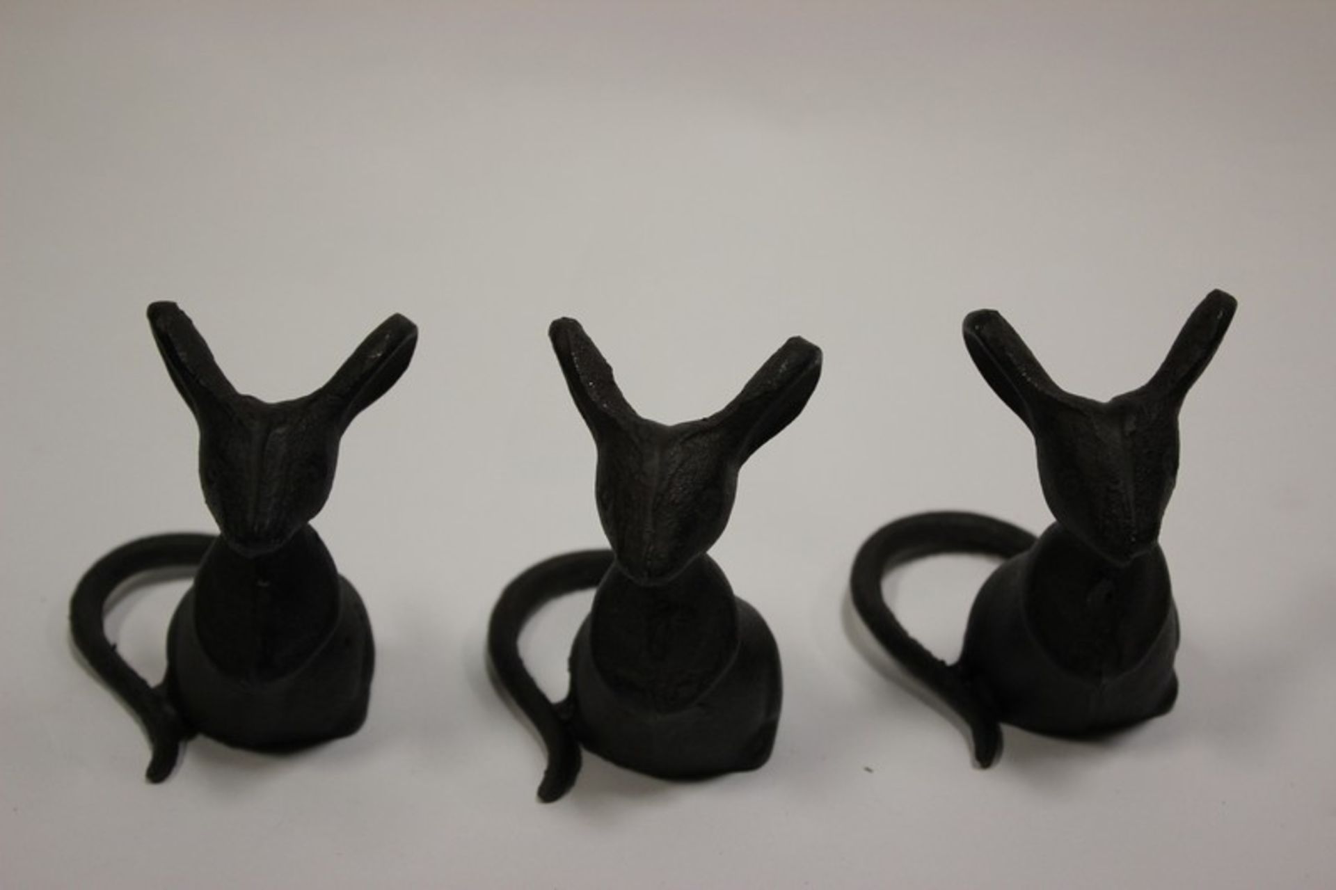 Eight decorative cast iron mice.