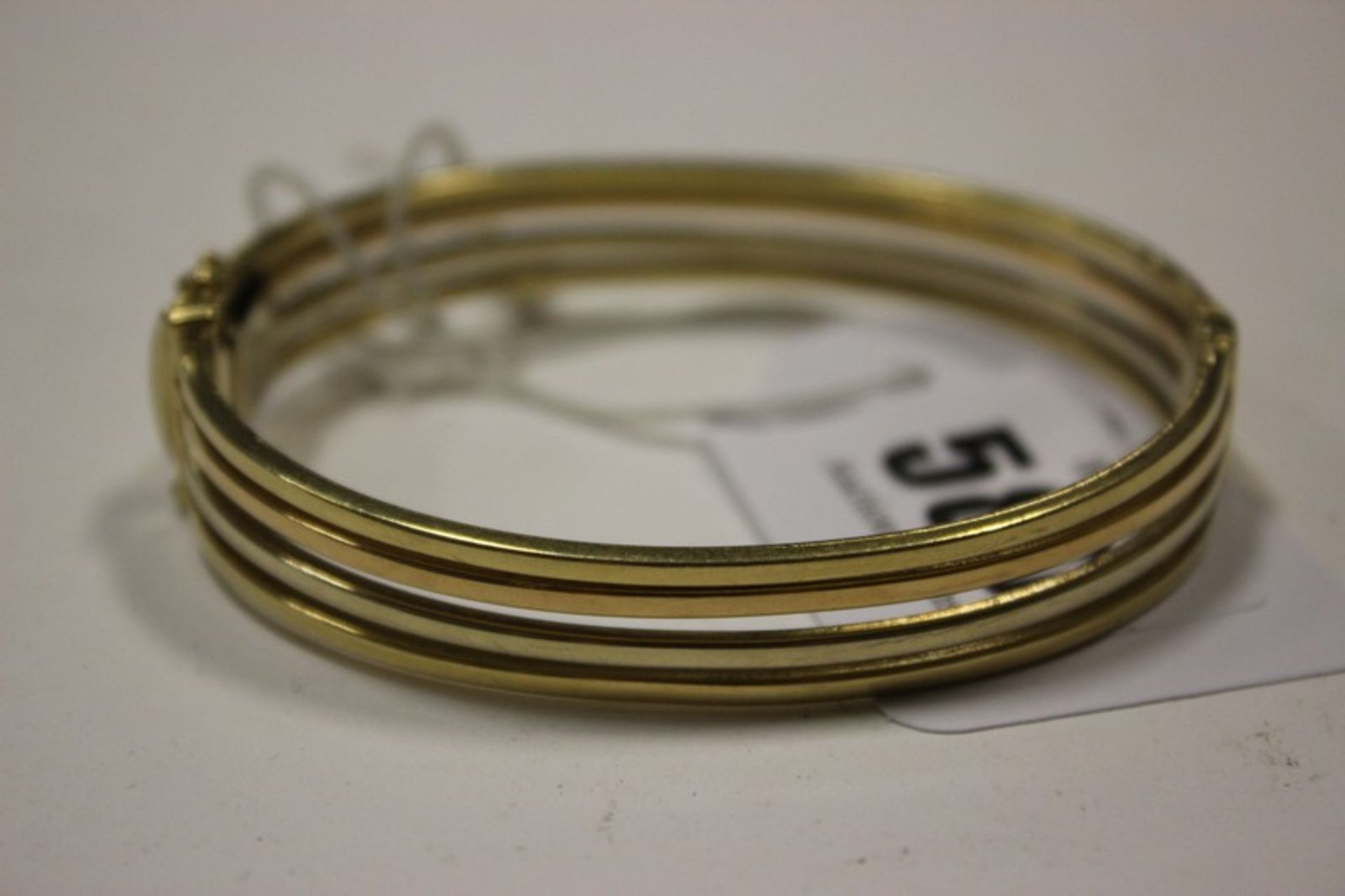An 18ct gold bangle, marked Italy 750, 30.2g.