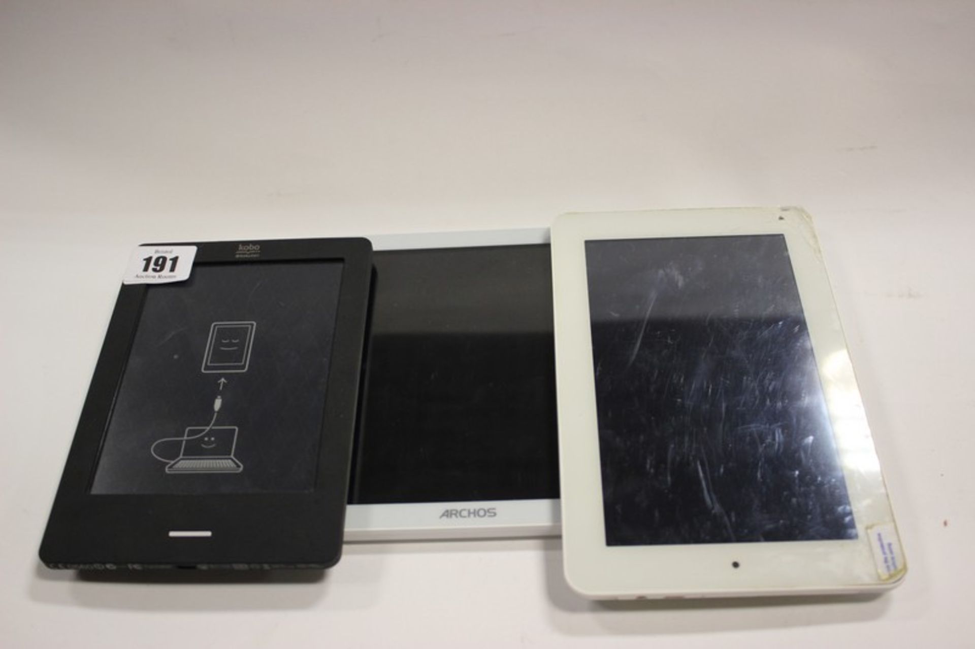 An Archos 101b Xenon tablet, Kobo Rakuten and another tablet.