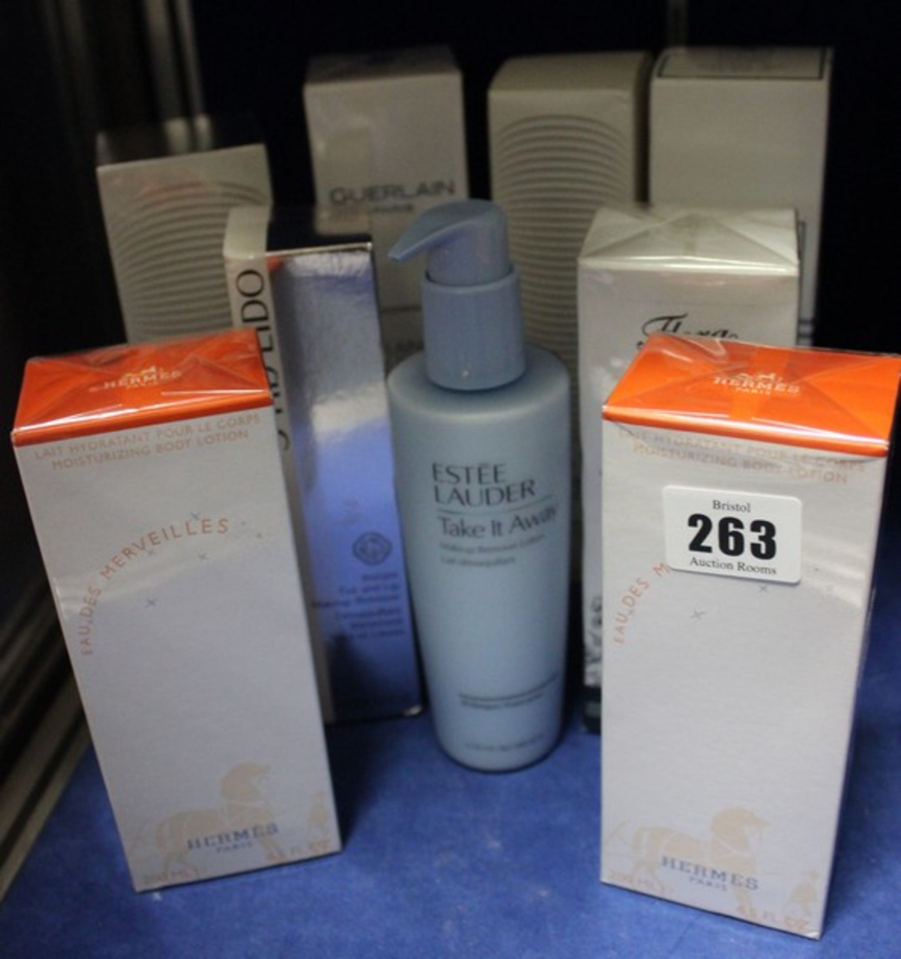 Nine assorted skincare/toiletries to include: Estee Lauder, Gucci, Hermes, Sisley, Guerlain and