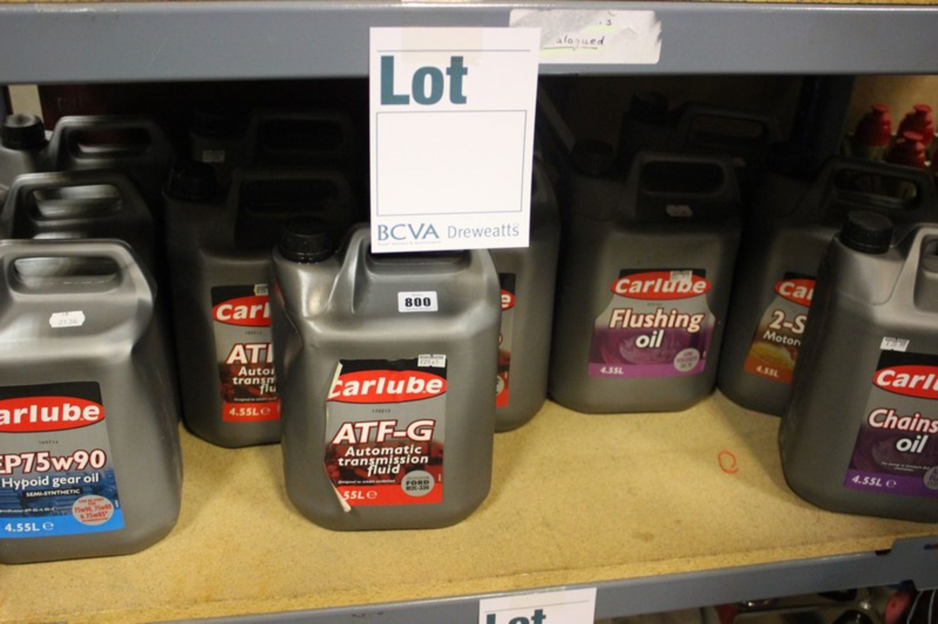 Twelve assorted Carlube oils; five AFT-G, three EP75w90, two flushing oil, one chainsaw oil and