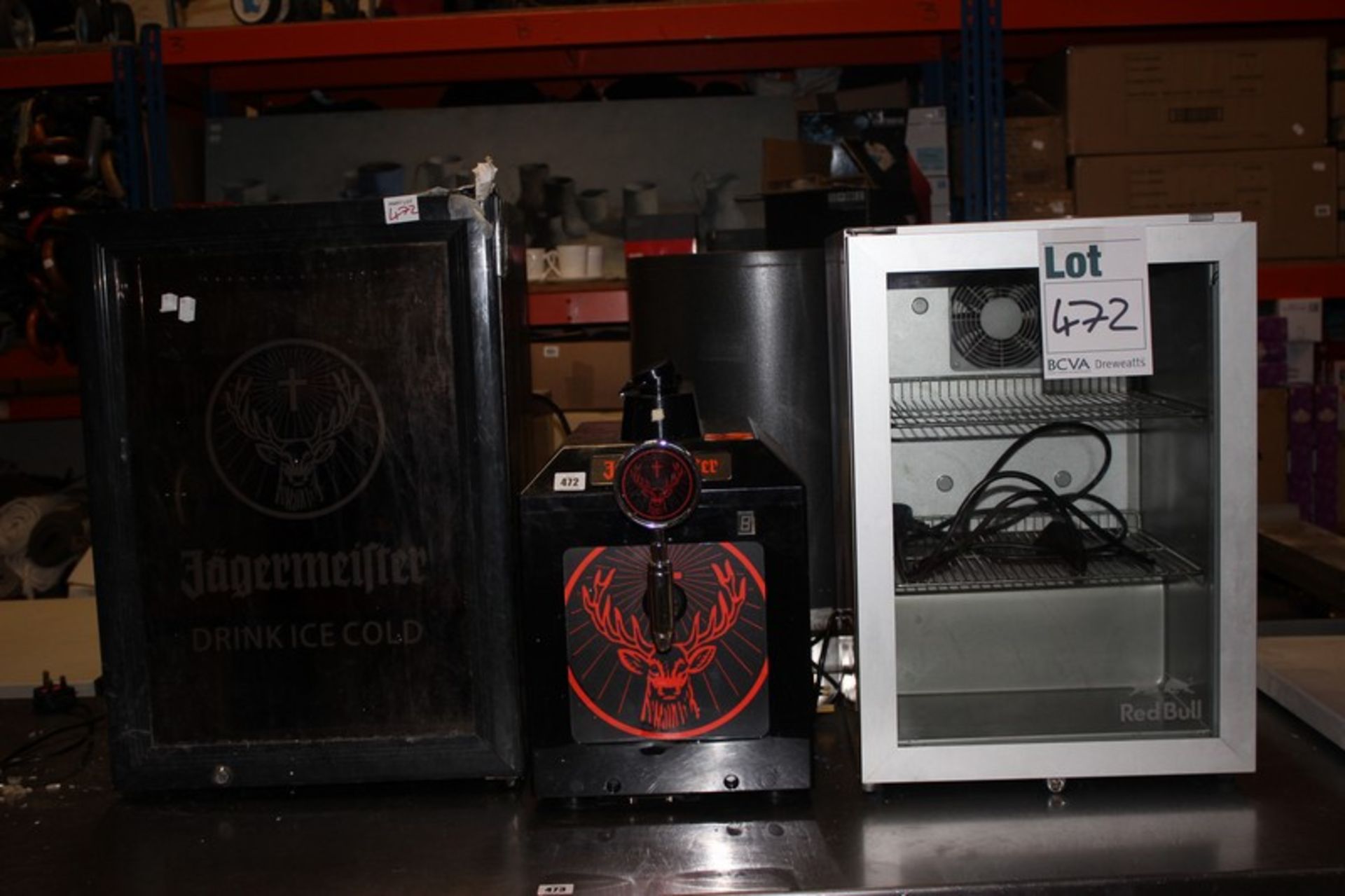 A Red Bull branded glazed canned drinks chiller, Jagermeister branded glass freezer and Jagermeister