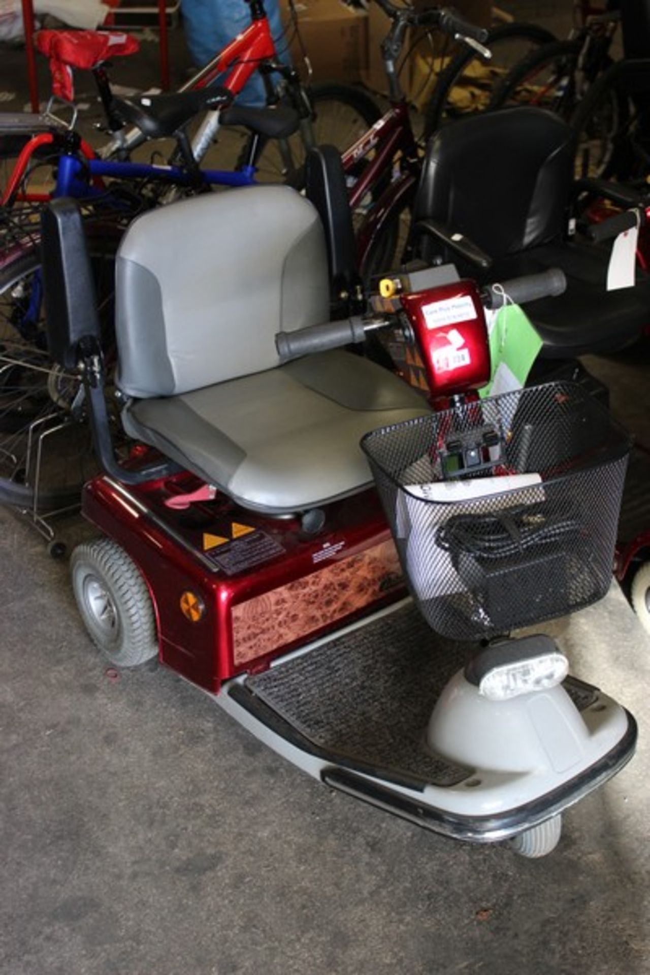 A Shoprider Soverign 3W mobility scooter with charger.