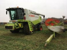 2006 Claas Lexion 580 combine harvester with V900 header and trolley. Reg No: AY06 JZG.