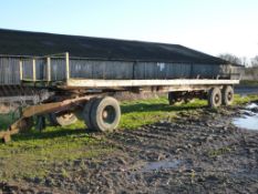 Twin axle flat bale trailer with wooden floor and towing bogey