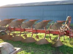 Kverneland 5 furrow vari-width reversible plough with rear disc