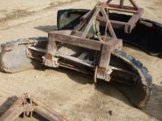 Rear mounted yard scraper