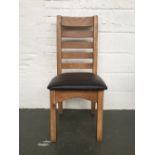 A set of six modern oak high ladder back chair with brown leatherette padded seat