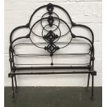A black Victorian wrought iron single bed