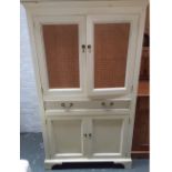 A Laura Ashley Cupboard with carved cornice, two doors with French cane panels,