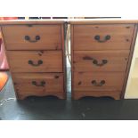 A pair of pine bedside tables with three drawers and drop handle over bracket feet