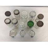 Thirteen preserve glass jars of various size