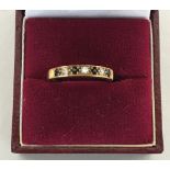 A 9ct gold half eternity ring with four saphires and three diamond chips (wt 2gr overall)