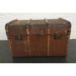 A canvas and wooden bound cabin trunk with leather handles to side 47x77x50cm