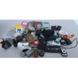 A large box of photographic accessories such as lens hoods, UV filters,
