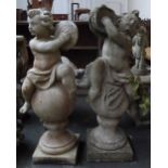 A pair of composite stone statues of cherubs playing tambourines and cymbals seated on globes (af)