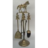 A brass fire companion with horse finial together with a lidded copper coal storage bucket