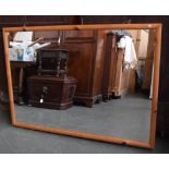 A large rectangular pine framed mirror 60 x 110cm together with another mantel mirror with metal