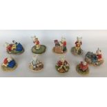 A collection of nine Arden sculptures of Rupert bear, boxed with certificate ref no R001, R002,