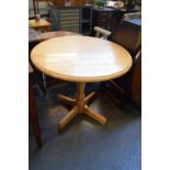 A modern round beech drop leaf table on turned base 90cmD x 75cmH