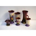 A quantity of Torquay pottery including hand painted floral design posey vases of various sizes and