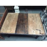 An Edwardian kitchen table with extra leaf and winder,