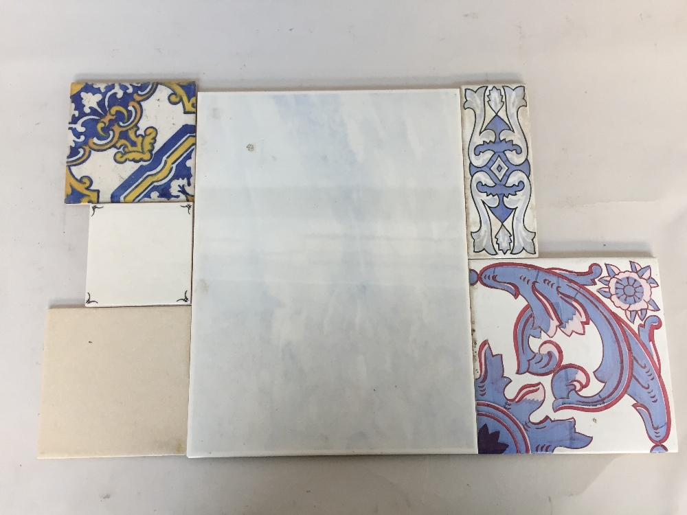A box of continental ceramic tiles various patterns and sizes together with some plain wall tiles