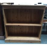 A modern pine bookcase with two shelves 92cmW