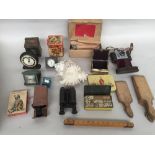 A mixed lot including a shell, a pair of binoculars, an Ilford Sportsman camera,
