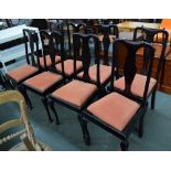 A set of 10 high back dining chairs with carved splats and drop in seats