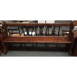 An oak church pew with carved ends 204cmW