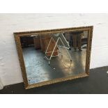 A large rectangular mirror with decorative gilt frame 128 x 100cm
