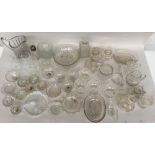 A large lot of glasses and cut glasses to include decanters, serving bowls, cake stand, jugs,