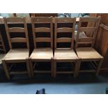 A set of four oak ladder back kitchen/dining chairs (4)
