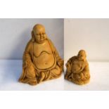 Two resin figurines of seated Buddas 18.