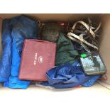 Vintage camping equipment to include a tent, a first aid kit, water bottles, candle cookers, a pump,