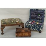 A tapestry footstool raised on stub cabriole legs 33x44x20 cm together with a fabric covered sewing