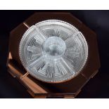 An Art Deco mirrored glass hors d' oeuvre dish with moulded glass segmented interior