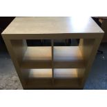 A contemporary set of beech effect shelves divided into four sections 79cmH x 79 x 30