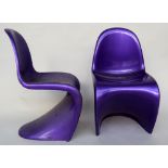 A set of four purple modern fiberglass chairs of contemporary design