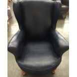 A Parker Knoll style wing back armchair in blue leather