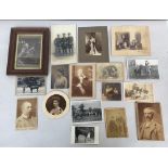 A collection of black and white photographs, many mounted on board,