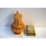 An alabaster trinket box and cover with metal claw feet together with a soapstone electic table