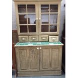 A cream painted kitchen dresser from Delderfields of Sidmouth comprising of two glass panel doors