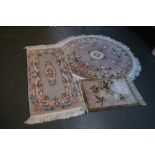 Two Chinese wool rugs of floral design together with a smaller prayer mat (3)