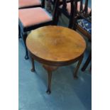 A round side table with four cabriole legs 56cmD x 47cmH
